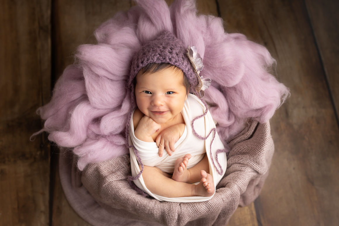 Sécurité et confort du nouveau né en séance photo