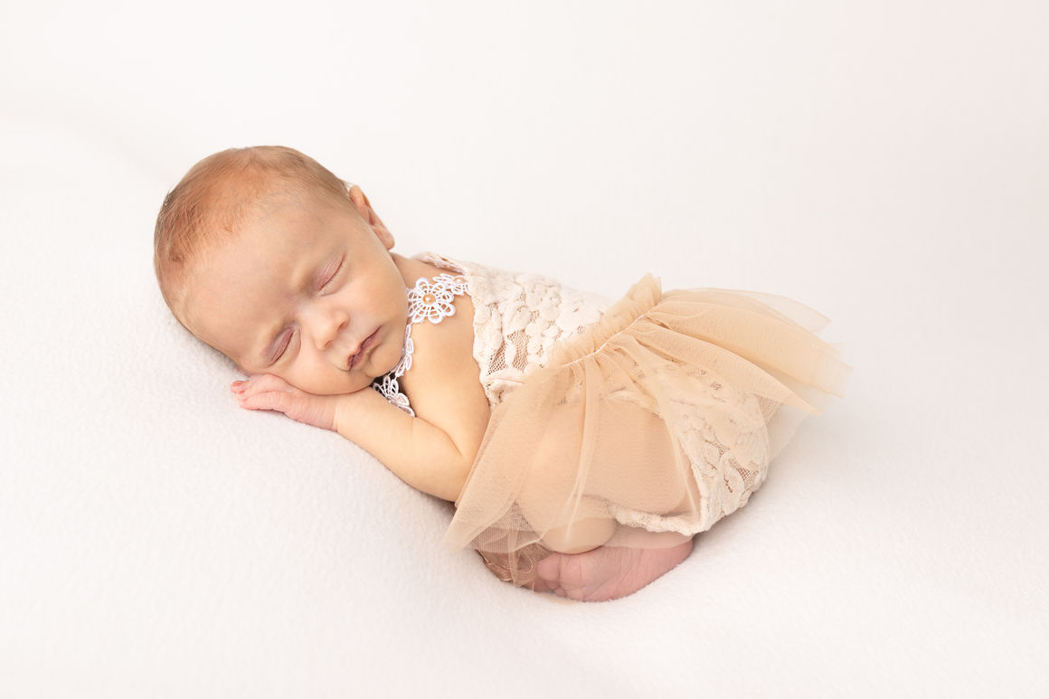 Sécurité et confort du nouveau né en séance photo